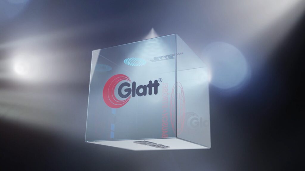 Screenshot aus dem Corporate Video von ExU zeigt einen dreidimensionalen Würfel mit dem Logo von Glatt auf einer Seite