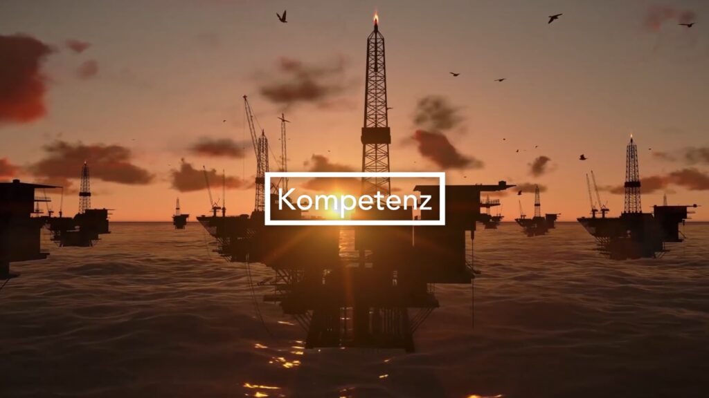 Screenshot aus dem Corporate Video von Liebherr mit dem Schriftzug Kompetenz vor einem Sonnenuntergang und Maritimen technischen Anlagen